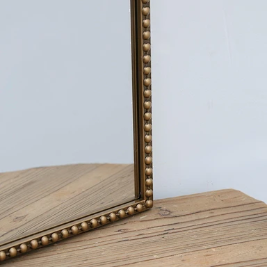 ancient mirror arched brass mirror brass arched mirror close up coner detail
